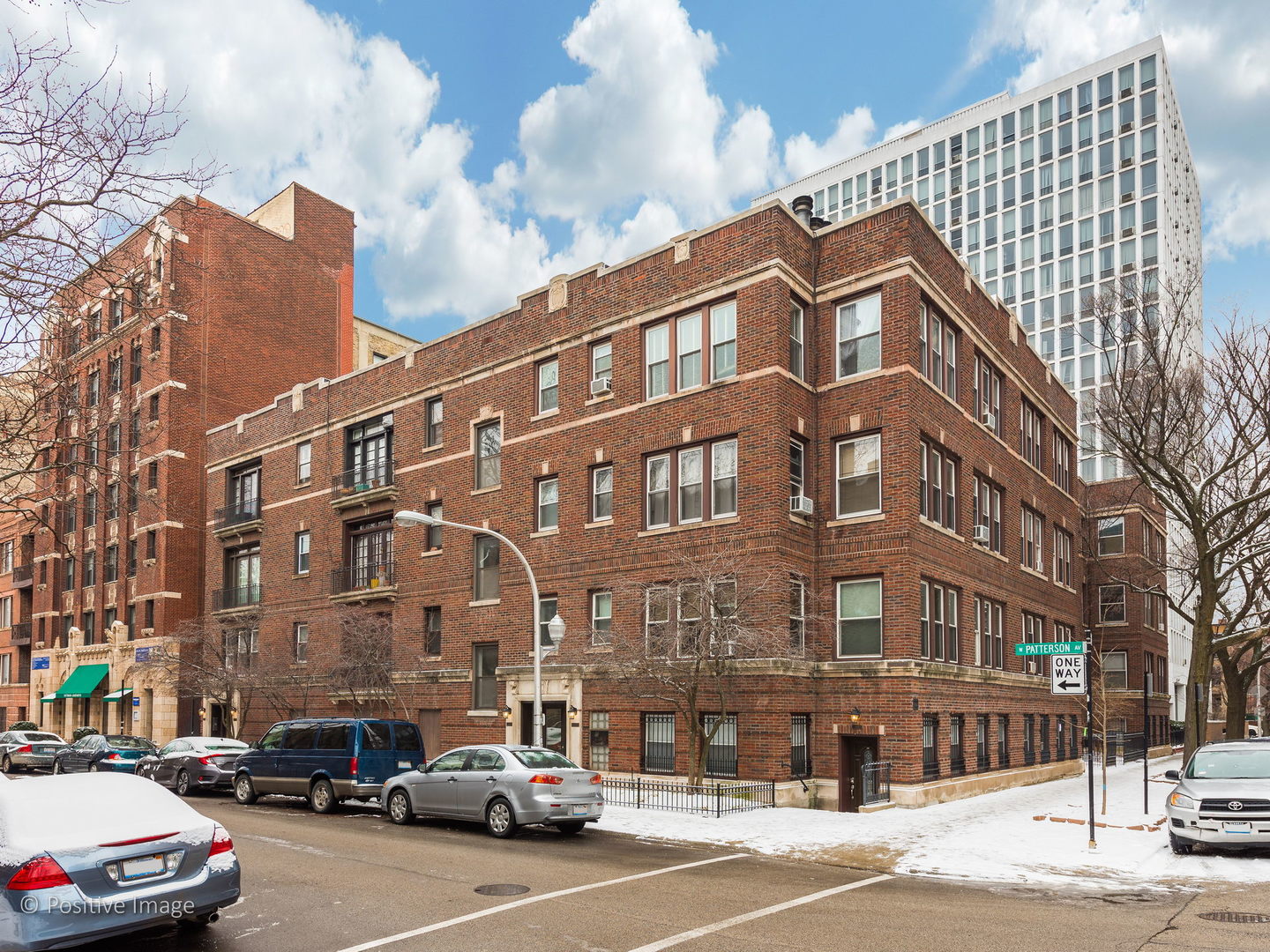 604 West Patterson Avenue, Unit 3A Chicago, IL 60613 - Photo 1 of 11 a couple of cars parked in front of brick building