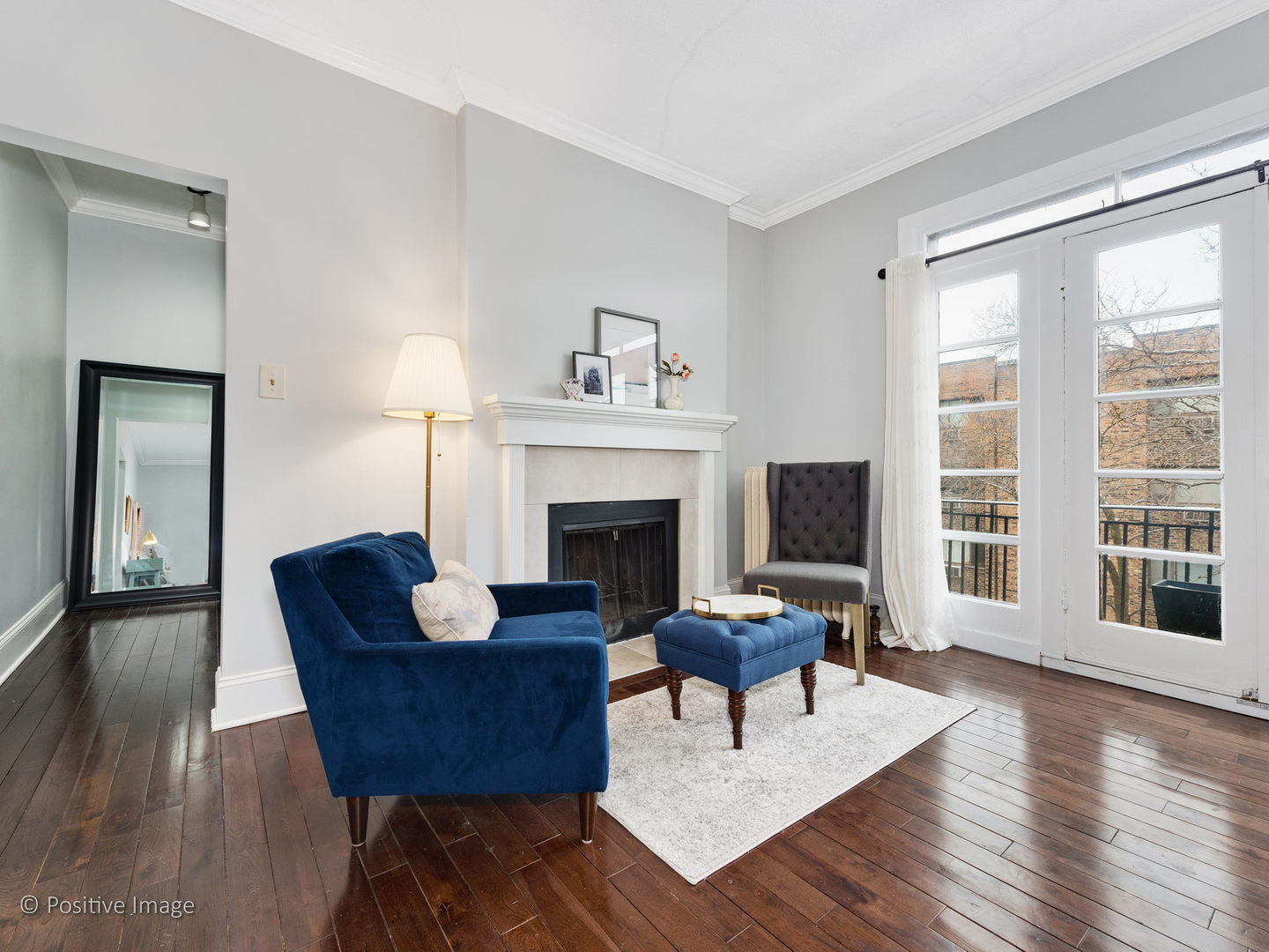 604 West Patterson Avenue, Unit 3A Chicago, IL 60613 - Photo 5 of 11 a living room with furniture and a fireplace