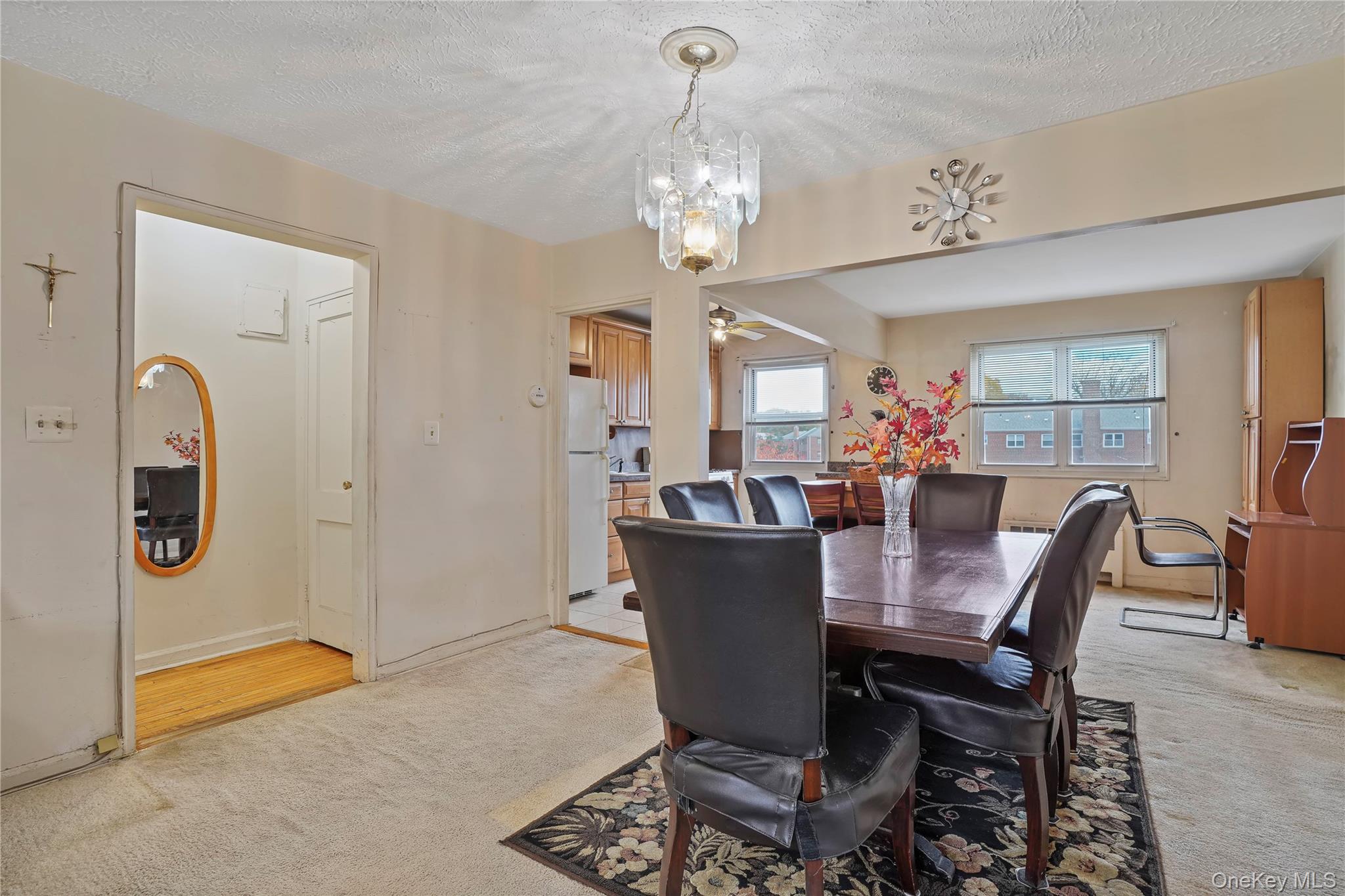 155-27 89th Street, Unit 27 Queens, NY 11414 - Photo 11 of 26 a view of a dining room with furniture and chandelier