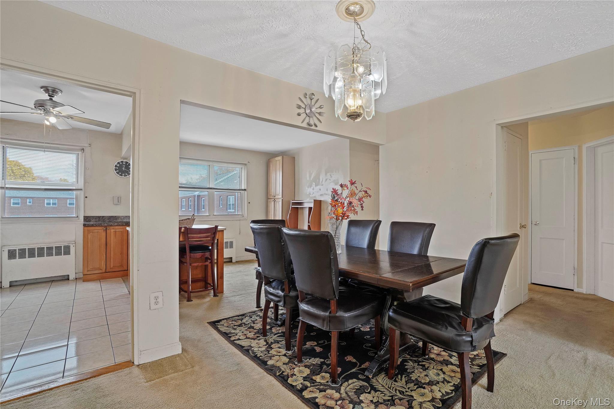 155-27 89th Street, Unit 27 Queens, NY 11414 - Photo 12 of 26 a view of a dining room with furniture and chandelier