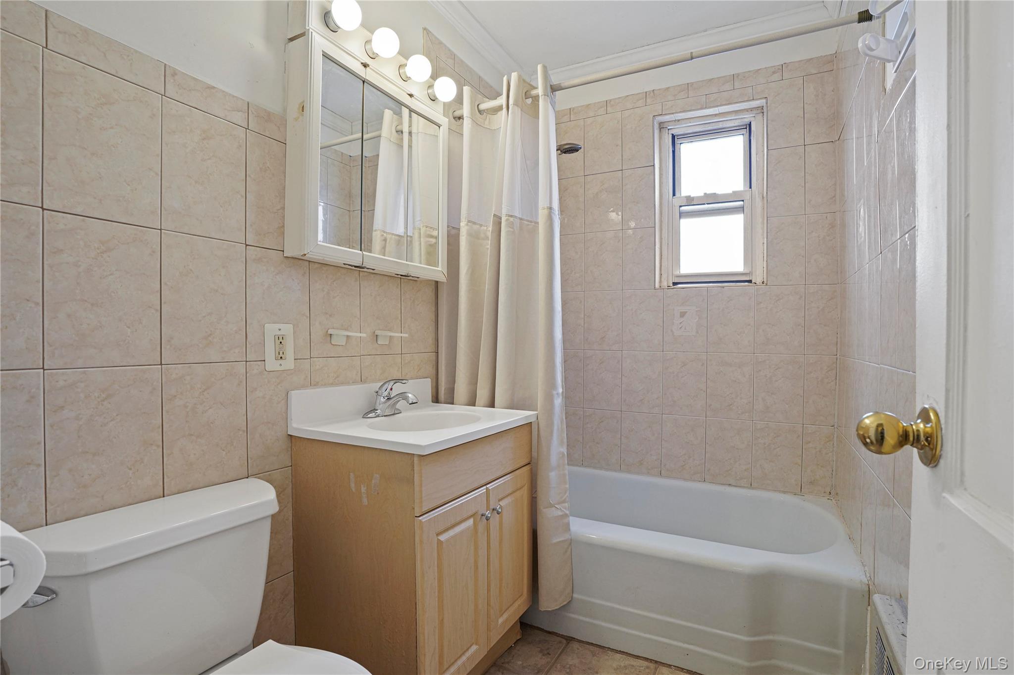 155-27 89th Street, Unit 27 Queens, NY 11414 - Photo 18 of 26 a bathroom with a sink toilet and shower
