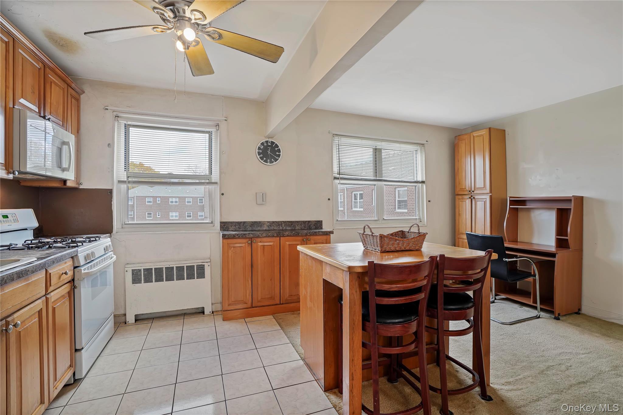 155-27 89th Street, Unit 27 Queens, NY 11414 - Photo 2 of 26 a kitchen that has a table and chairs in it