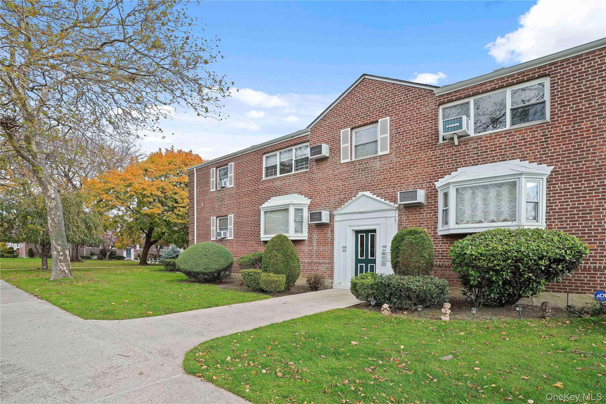 155-27 89th Street, Unit 27 Queens, NY 11414 - Photo 22 of 26 a front view of a house with a yard