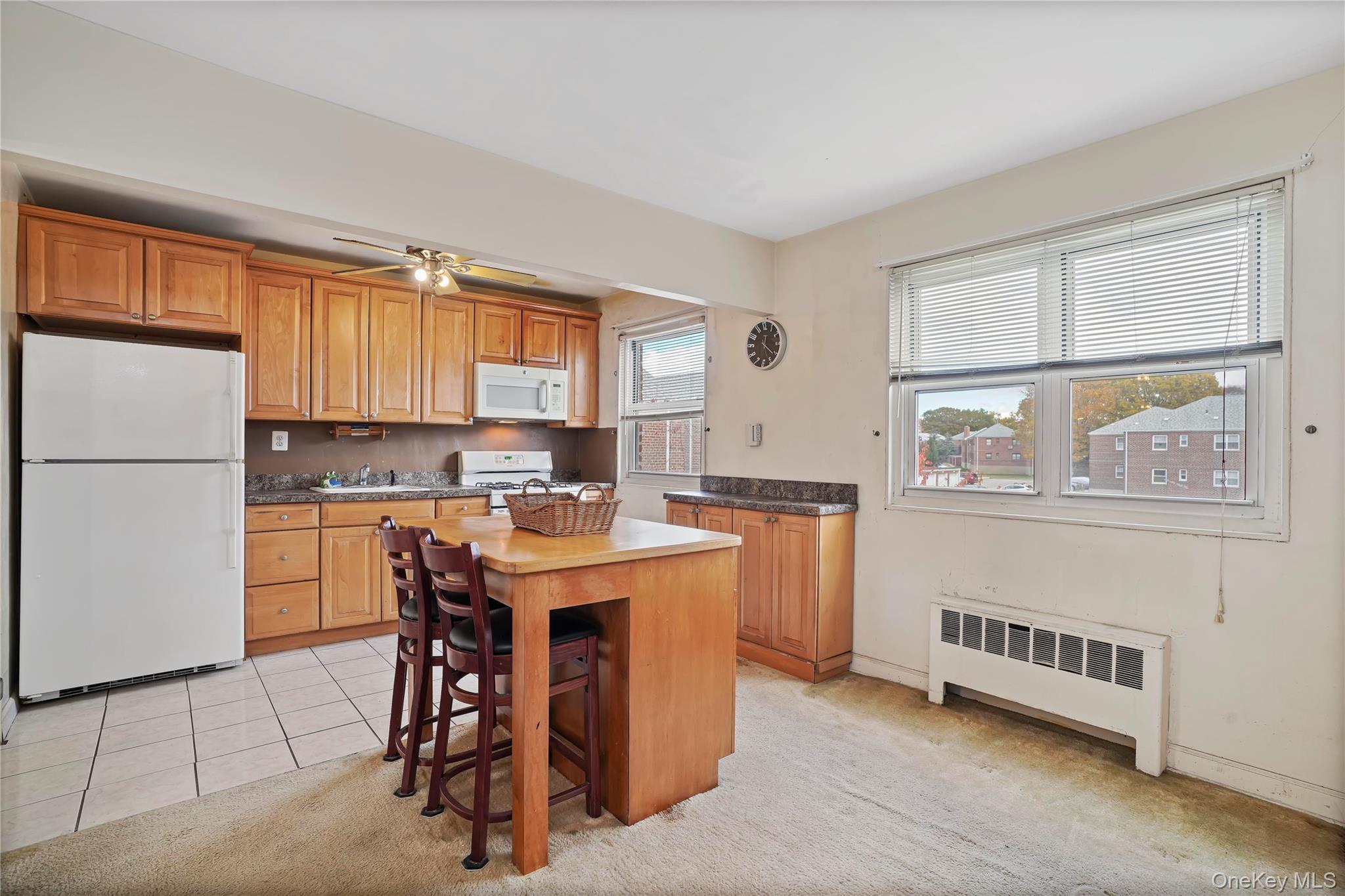 155-27 89th Street, Unit 27 Queens, NY 11414 - Photo 3 of 26 a kitchen with stainless steel appliances granite countertop a refrigerator a sink dishwasher a stove with white cabinets and wooden floor