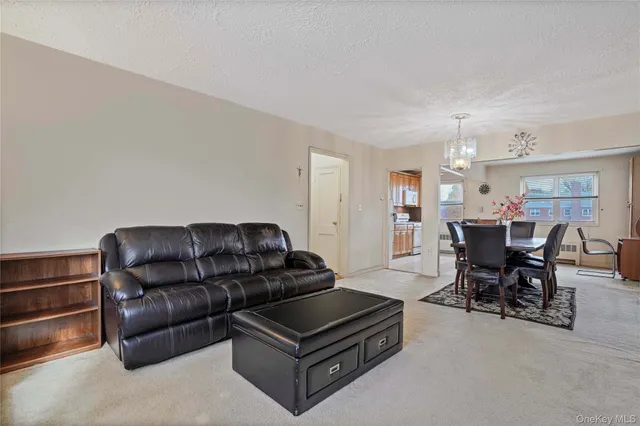 a view of a workspace with furniture and a couch