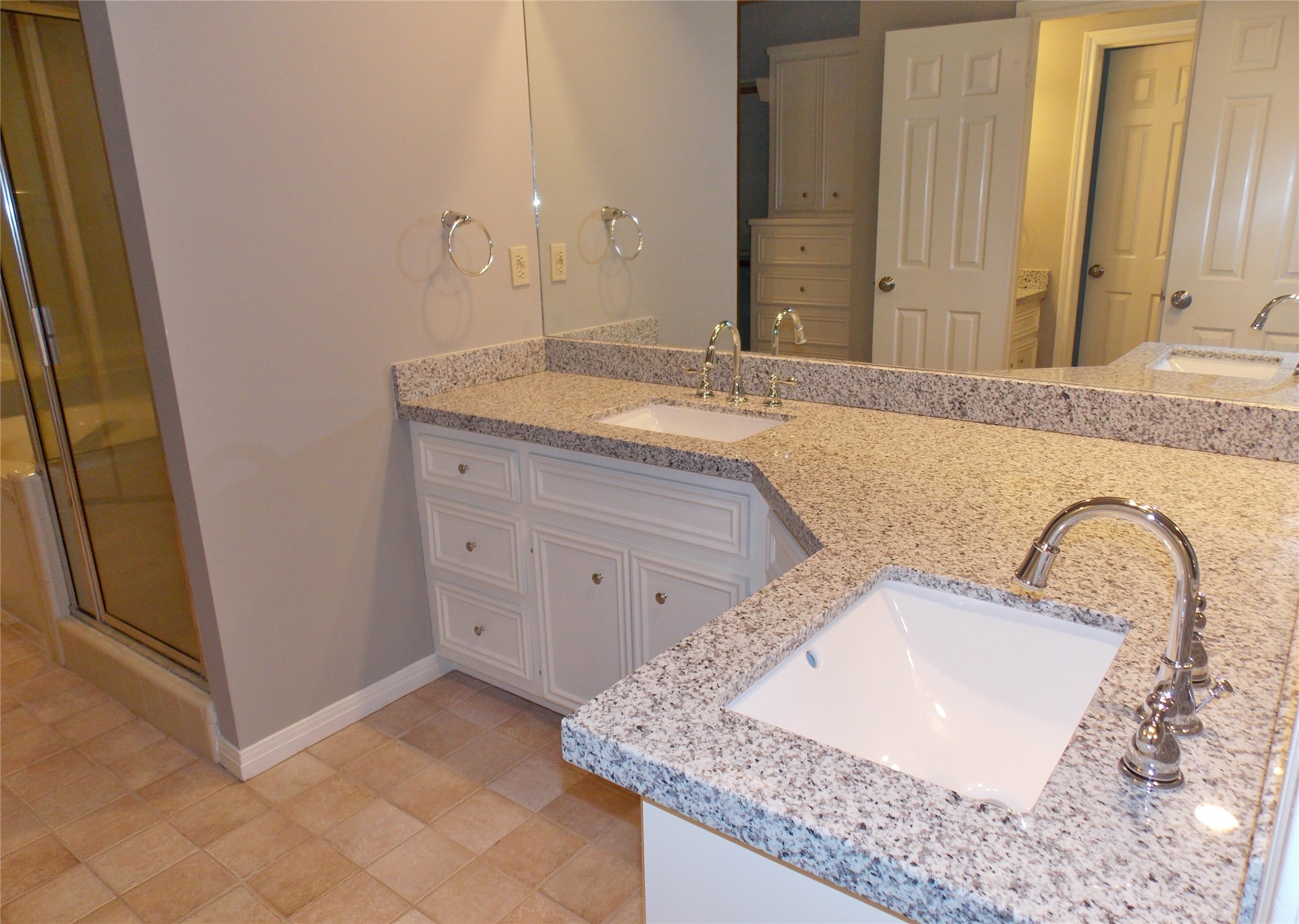 6607 Tournament Drive Houston, TX 77069 - Photo 18 of 46 a bathroom with a granite countertop sink and a mirror