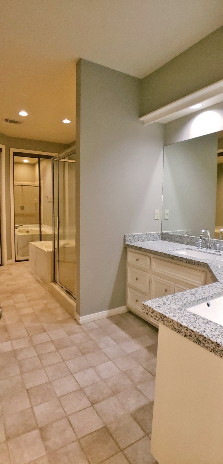 6607 Tournament Drive Houston, TX 77069 - Photo 19 of 46 a bathroom with a granite countertop sink and a mirror