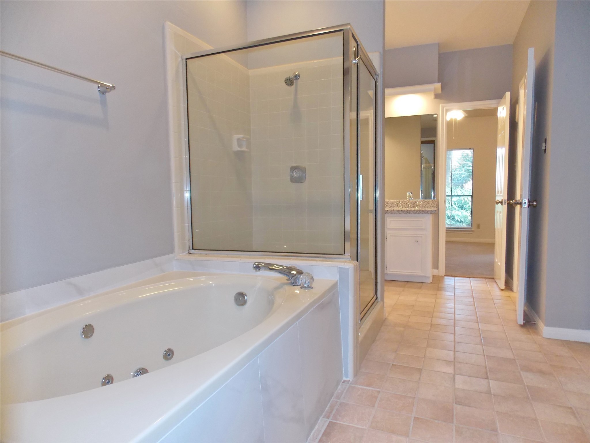 6607 Tournament Drive Houston, TX 77069 - Photo 20 of 46 a bathroom with a tub a sink and a shower