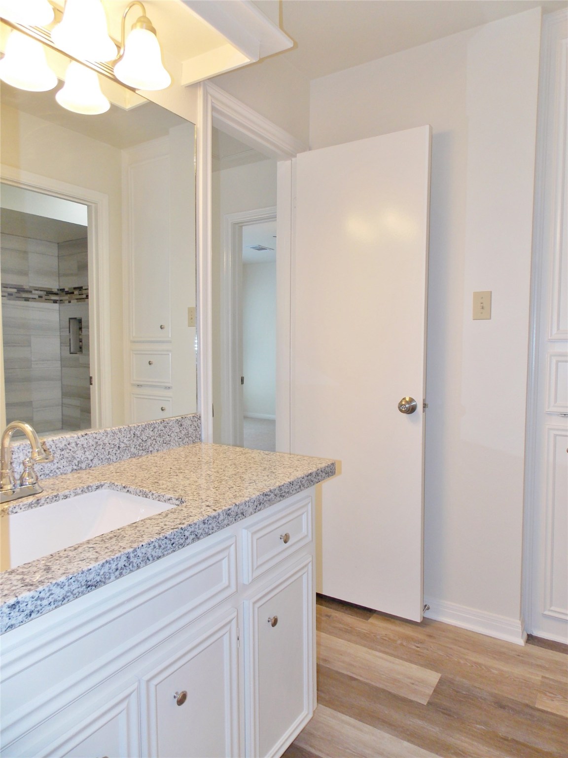 6607 Tournament Drive Houston, TX 77069 - Photo 34 of 46 a bathroom with a granite countertop sink and mirror