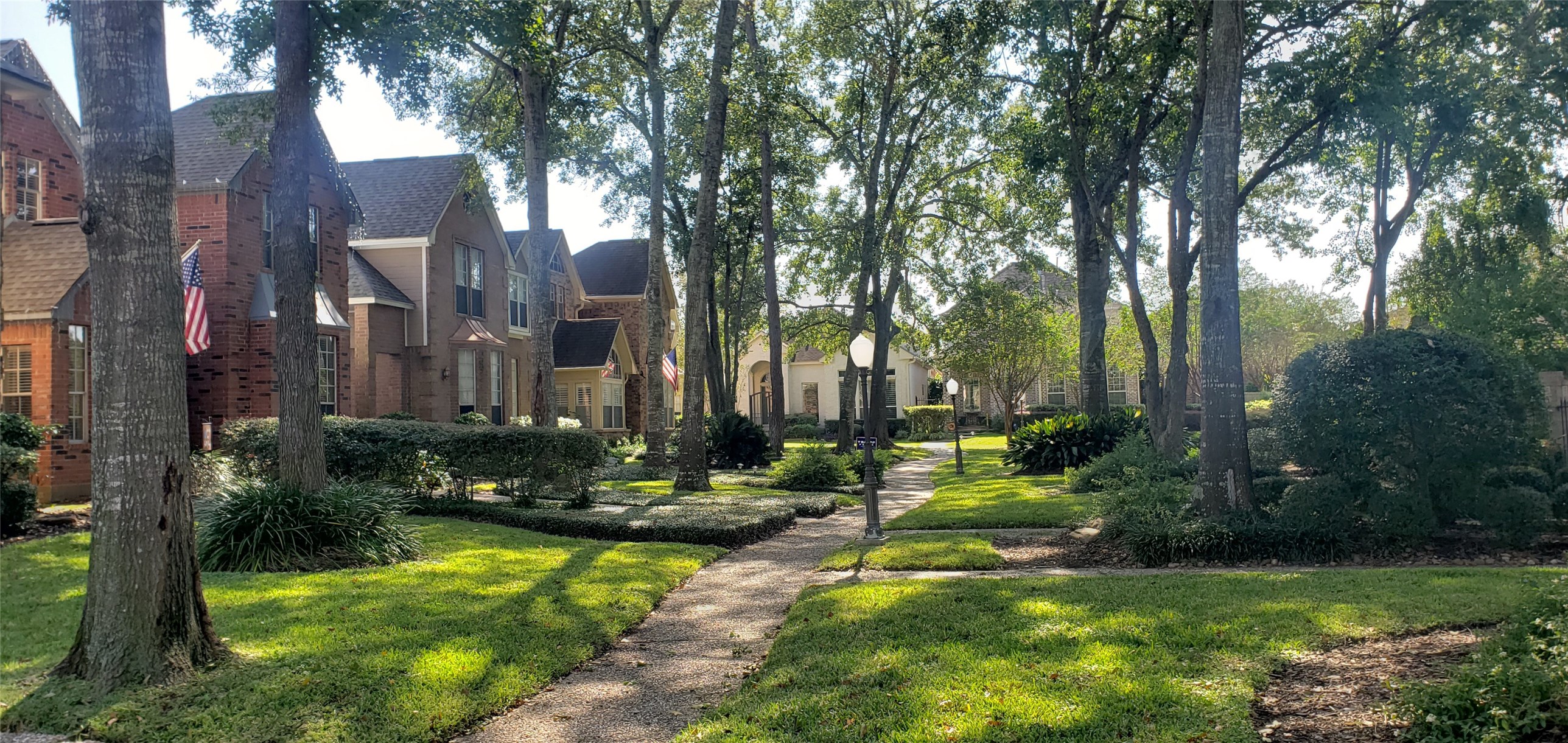 6607 Tournament Drive Houston, TX 77069 - Photo 41 of 46 a view of a fountain in front of a brick house