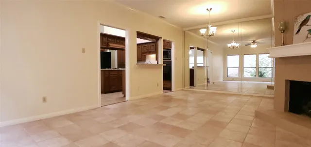 a view of an empty room with a fireplace