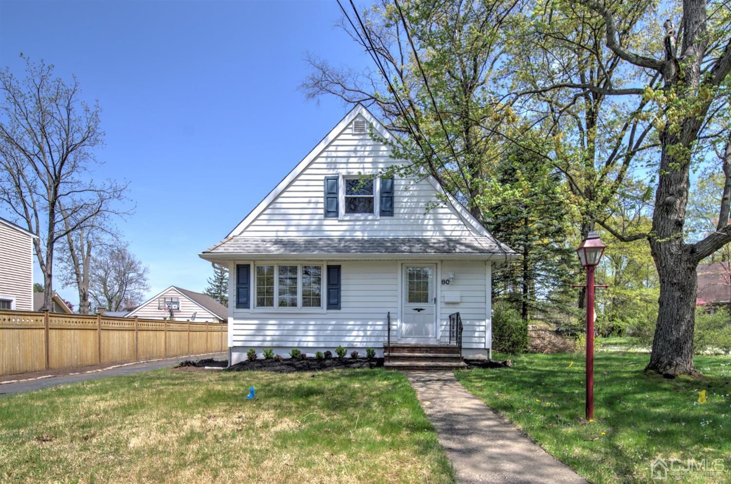 80 North Hill Road Colonia, NJ 07067 - Photo 1 of 23 a view of a house with a big yard plants and large trees