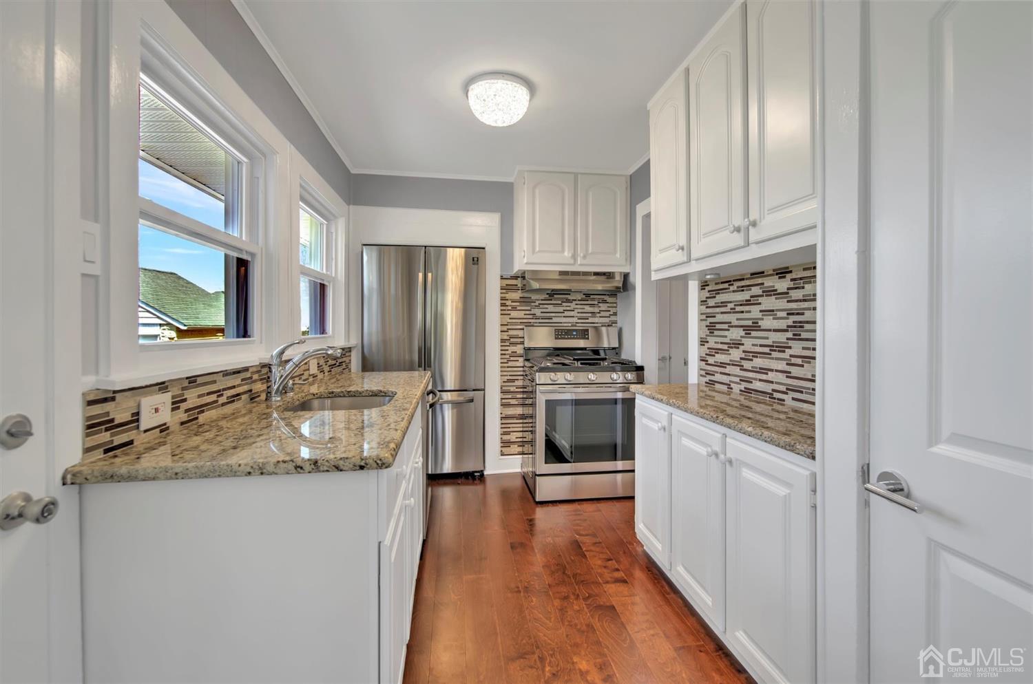 80 North Hill Road Colonia, NJ 07067 - Photo 2 of 23 a kitchen with stainless steel appliances granite countertop a refrigerator and a sink
