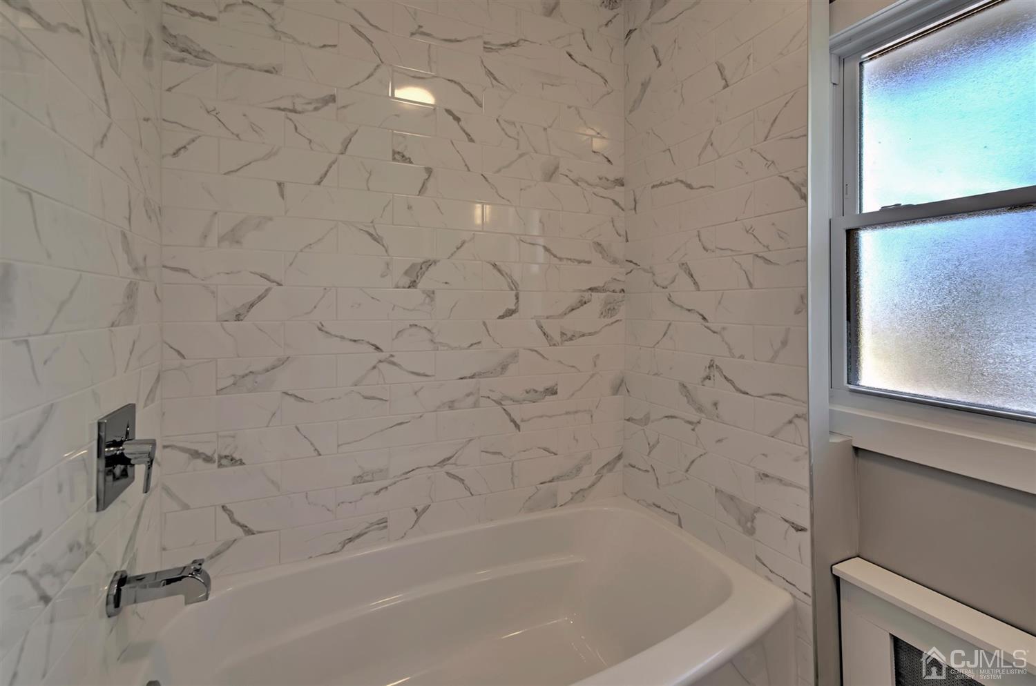 80 North Hill Road Colonia, NJ 07067 - Photo 12 of 23 a bathroom with a bathtub