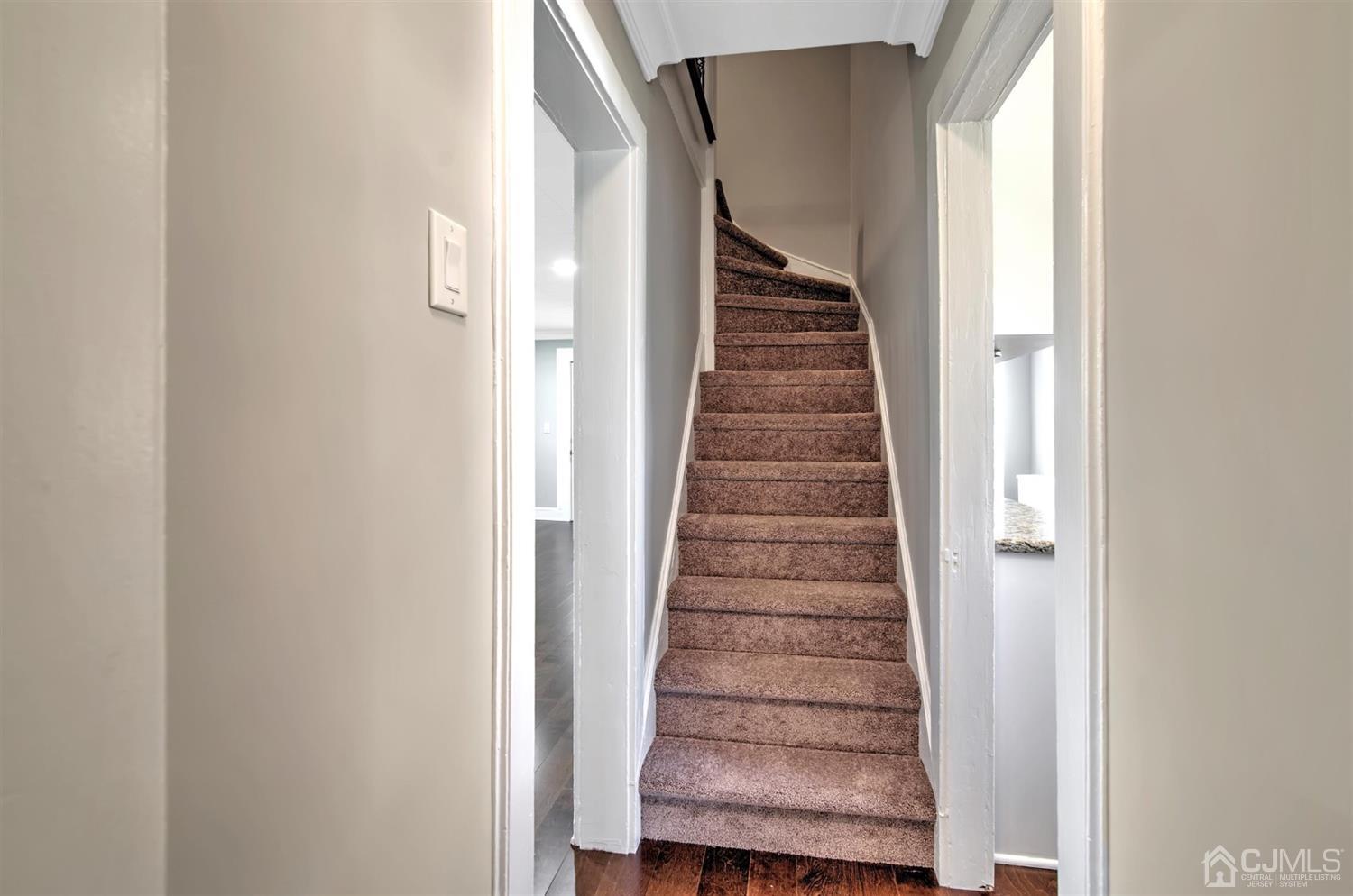 80 North Hill Road Colonia, NJ 07067 - Photo 14 of 23 a view of entryway with wooden floor and stairs