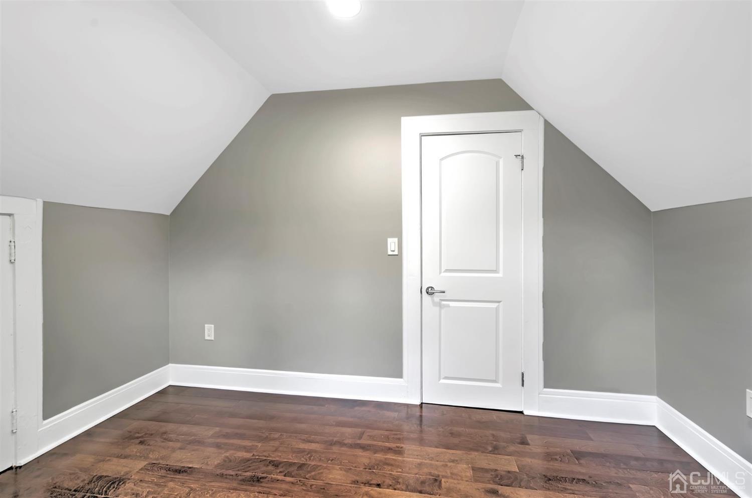 80 North Hill Road Colonia, NJ 07067 - Photo 18 of 23 an empty room with wooden floor and closet