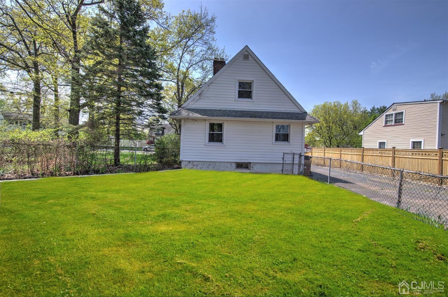 80 North Hill Road Colonia, NJ 07067 - Photo 23 of 23 a front view of house with yard and green space