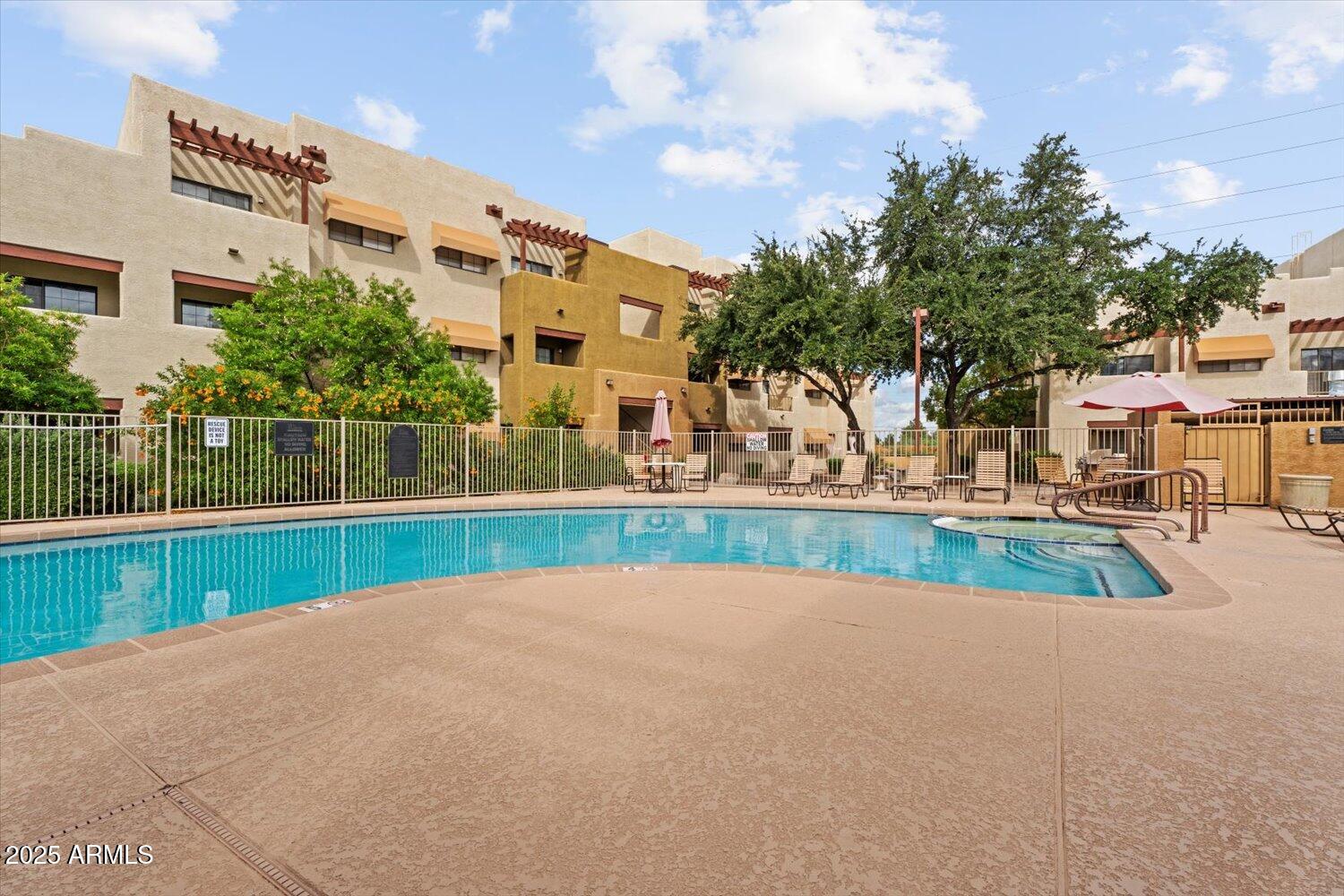 3434 East Baseline Road, Unit 260 Phoenix, AZ 85042 - Photo 13 of 15 a view of yard with swimming pool and tall trees