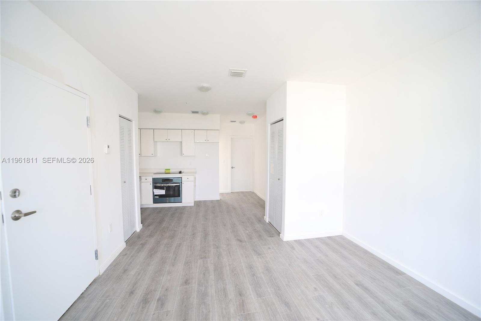 810 7th Street, Unit 104 Miami Beach, FL 33139 - Photo 6 of 11 a view of a hallway with wooden floor