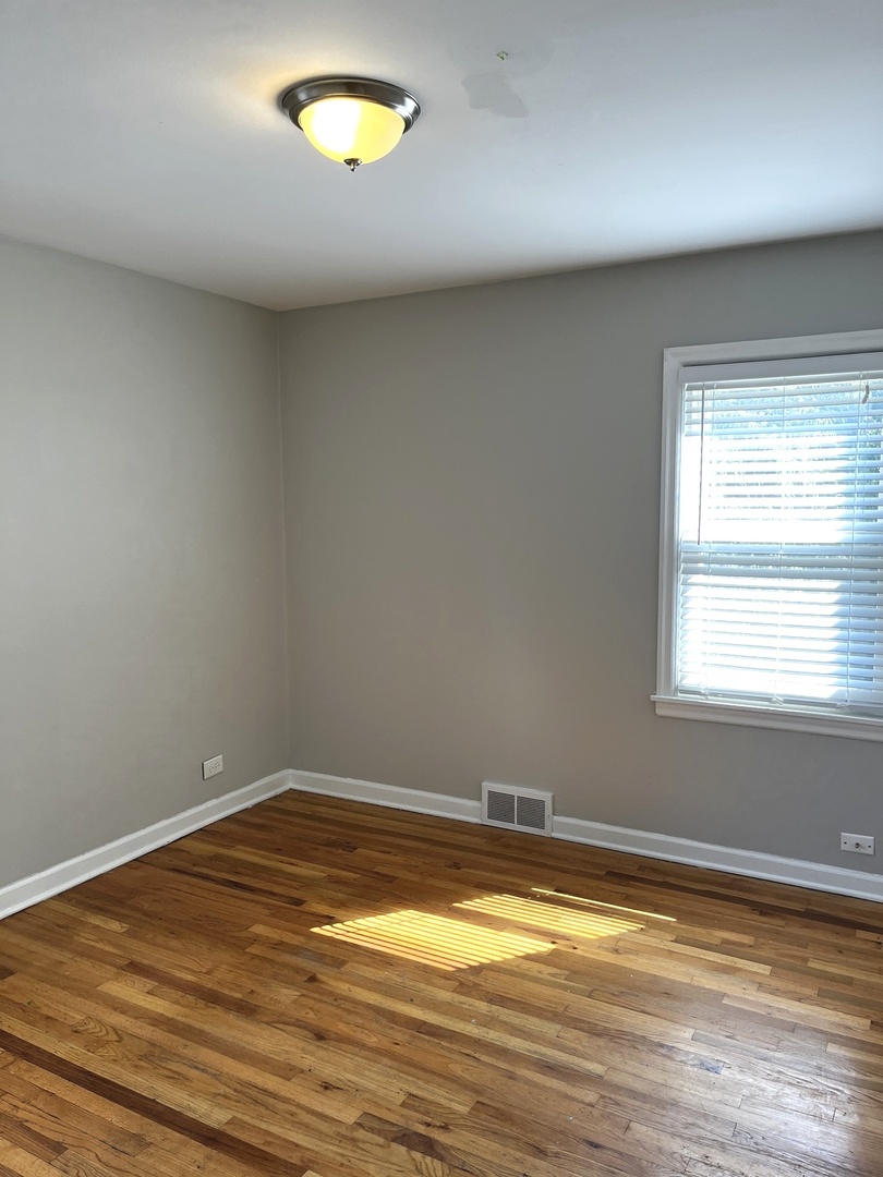 17107 Longfellow Avenue Hazel Crest, IL 60429 - Photo 18 of 21 an empty room with a window