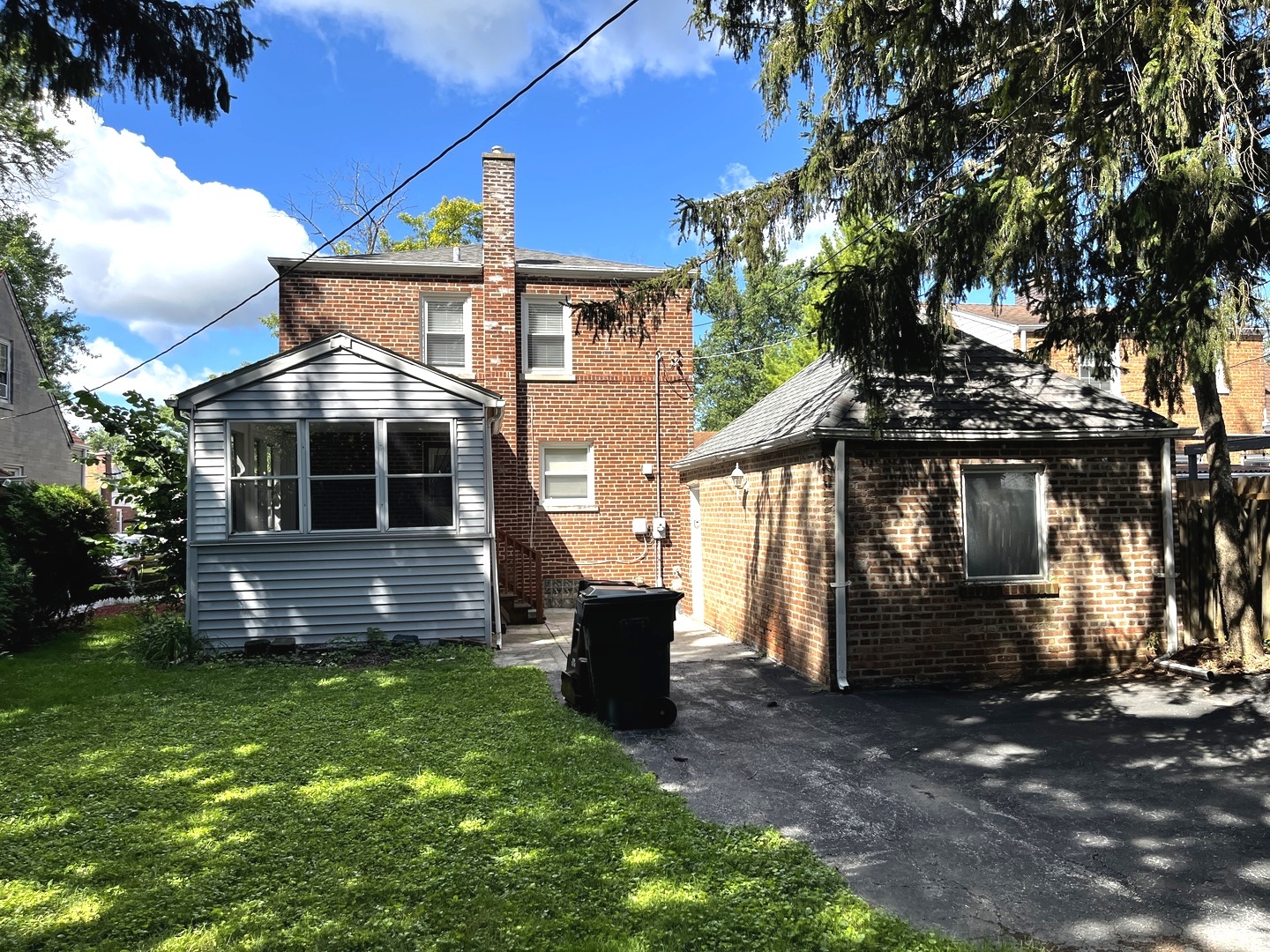 17107 Longfellow Avenue Hazel Crest, IL 60429 - Photo 21 of 21 a front view of a house with a garden