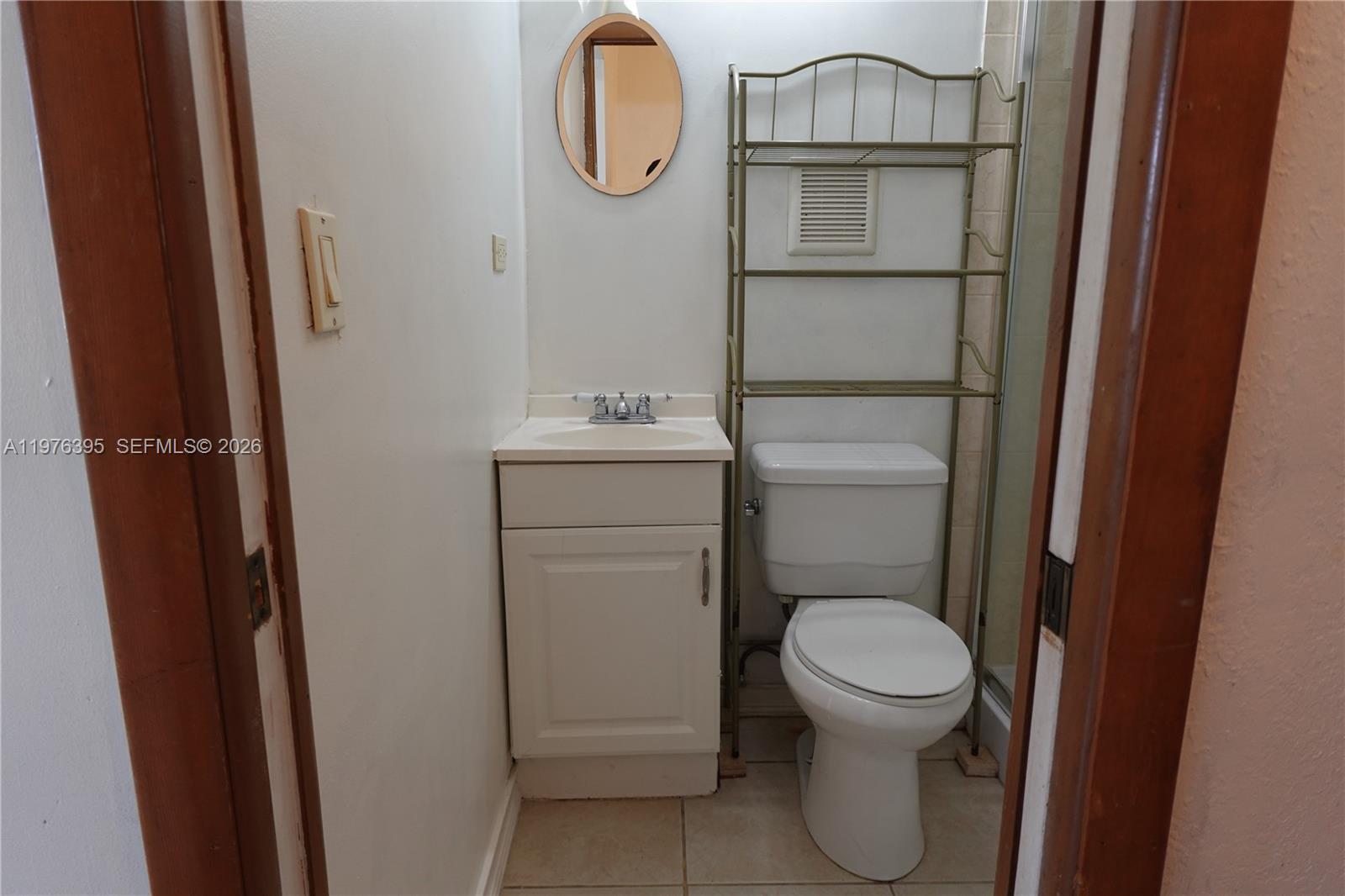 11262 Southwest 74th Street Miami, FL 33173 - Photo 16 of 19 a bathroom with a toilet and a sink