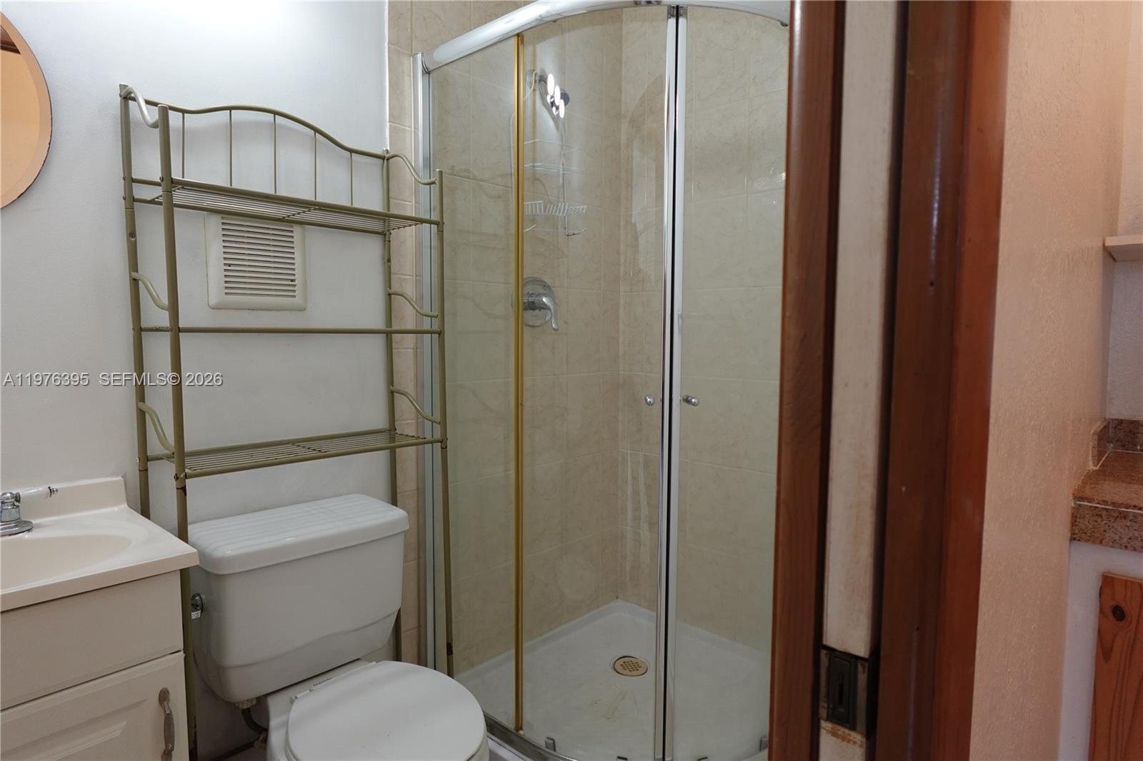 11262 Southwest 74th Street Miami, FL 33173 - Photo 18 of 19 a bathroom with a toilet and a shower