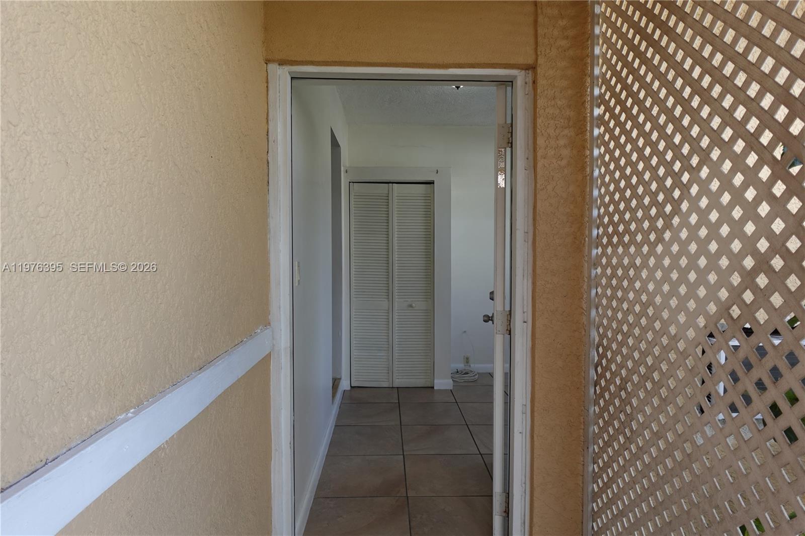 11262 Southwest 74th Street Miami, FL 33173 - Photo 3 of 19 a view of a bathroom from a hallway