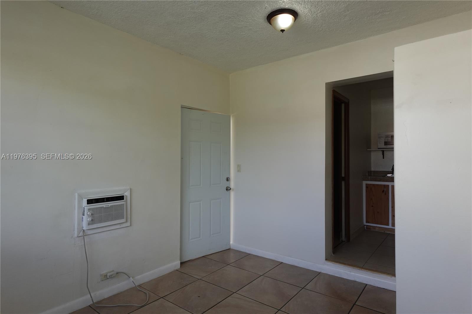 11262 Southwest 74th Street Miami, FL 33173 - Photo 5 of 19 a view of an empty room and closet
