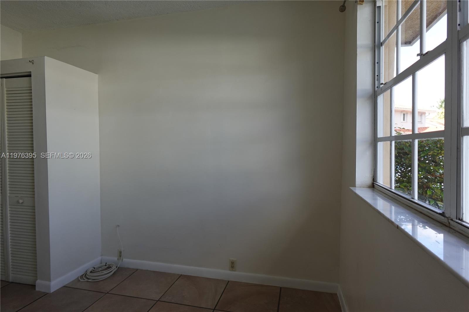 11262 Southwest 74th Street Miami, FL 33173 - Photo 6 of 19 a small space with a window