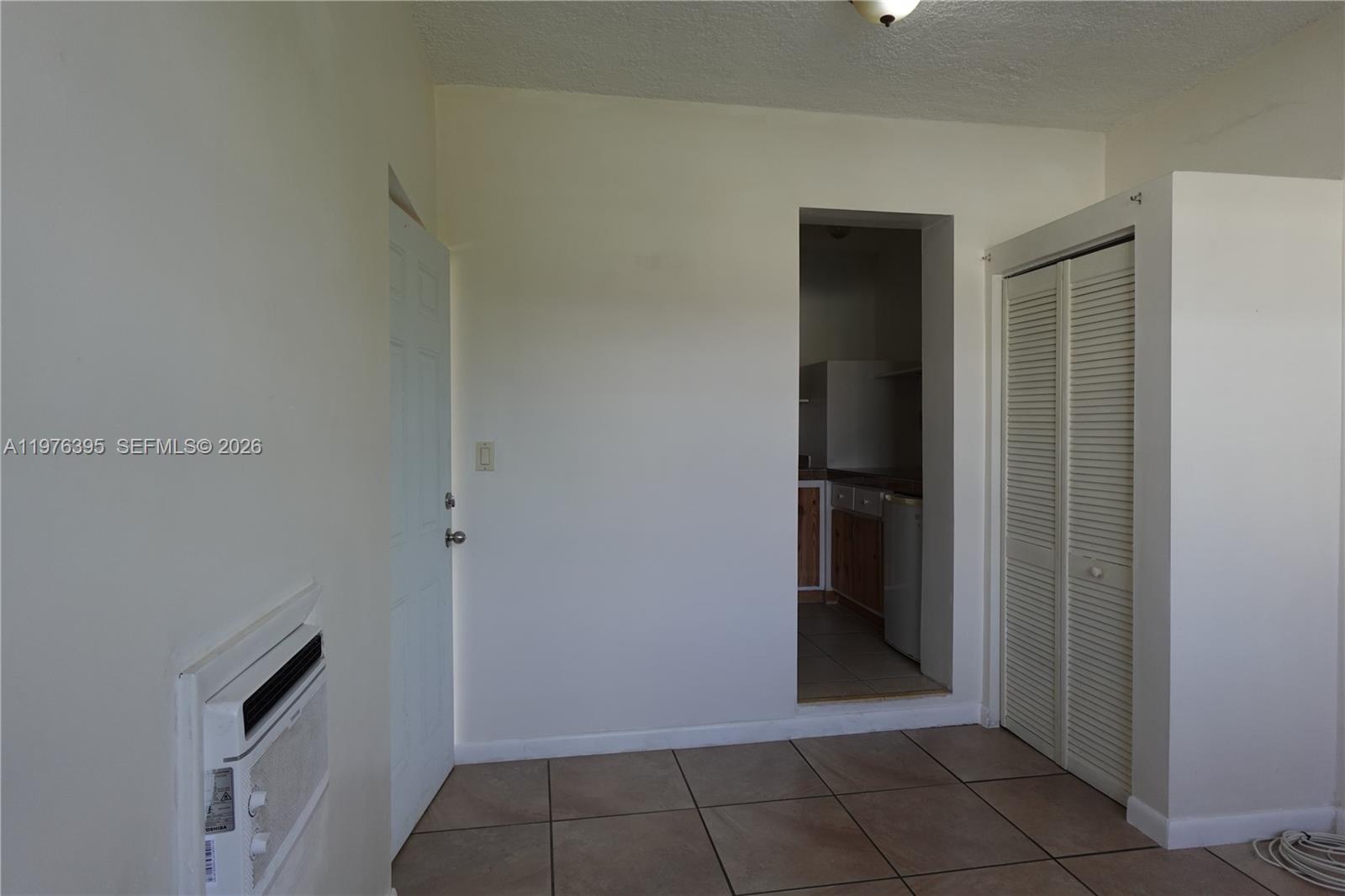11262 Southwest 74th Street Miami, FL 33173 - Photo 7 of 19 a view of empty room