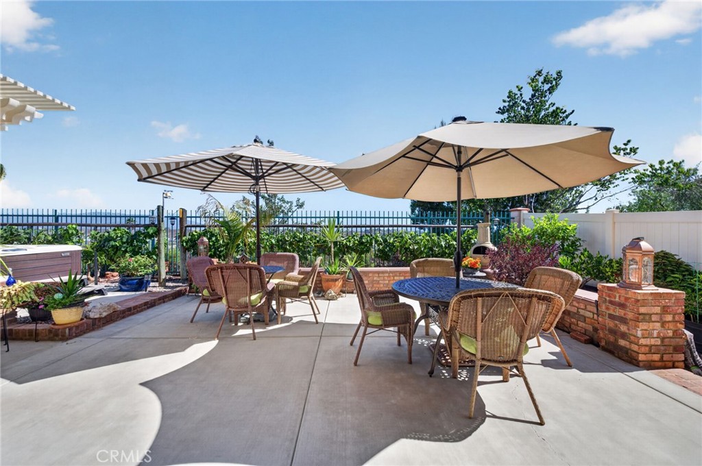 31749 Country View Road Temecula, CA 92591 - Photo 46 of 68 a view of a patio with chairs and a umbrella