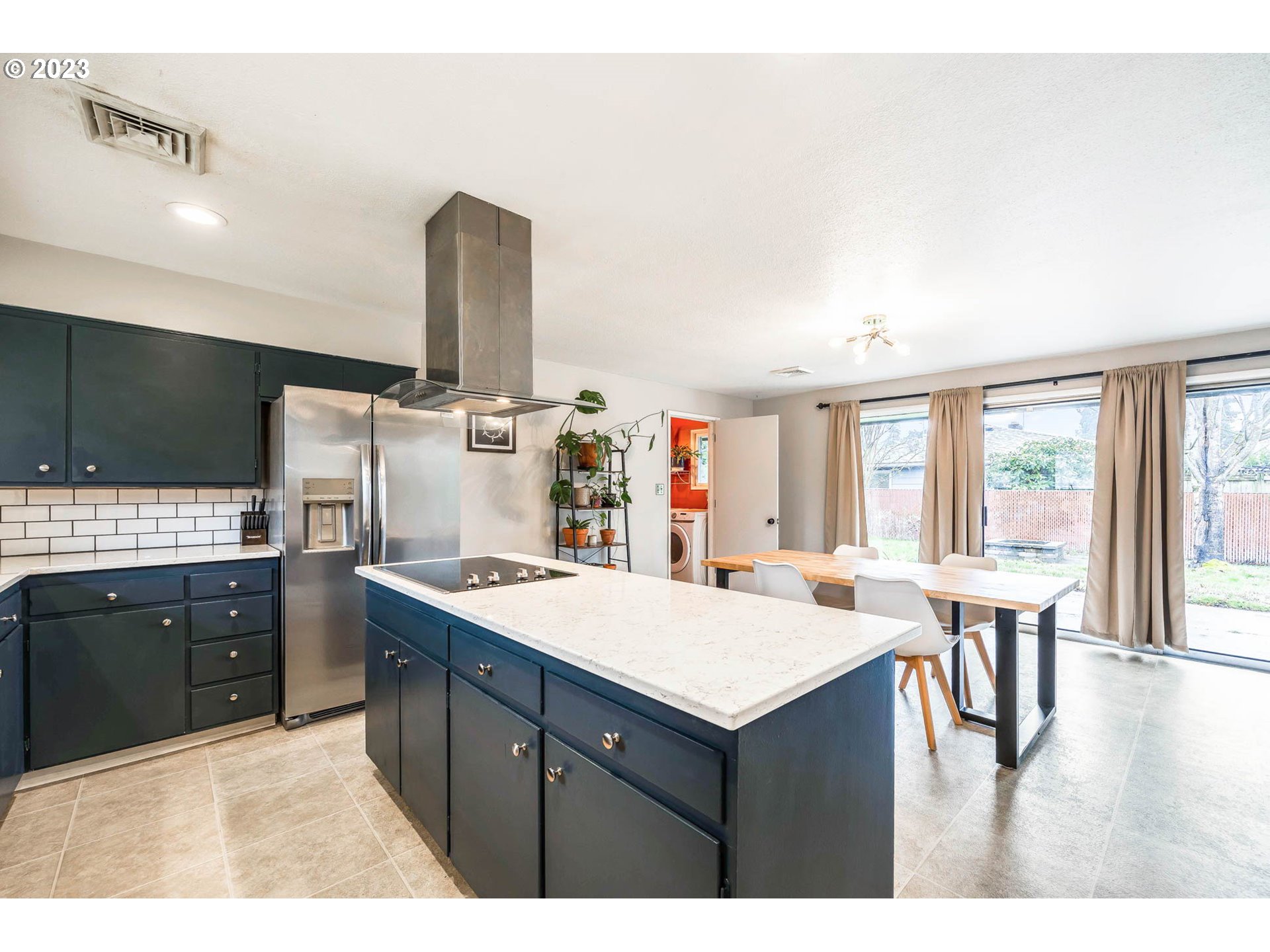 3170 Raleighwood Avenue Springfield, OR 97477 - Photo 8 of 27 a kitchen with a stove a refrigerator and wooden floor