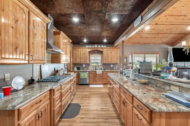 a large kitchen with granite countertop lots of counter top space