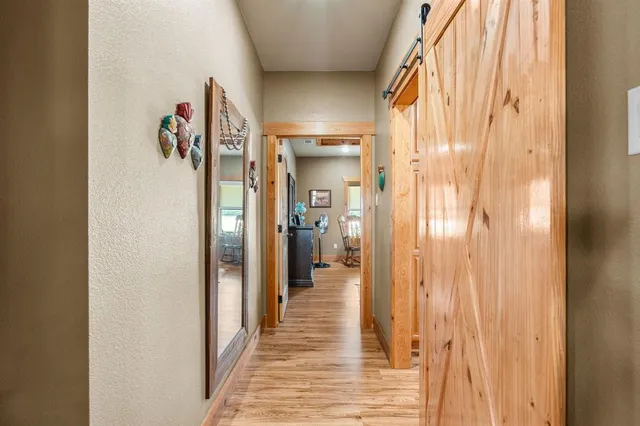 a bathroom with a granite countertop sink a mirror and shower