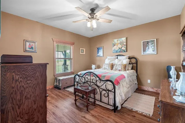 a room with wooden furniture and a flat screen tv