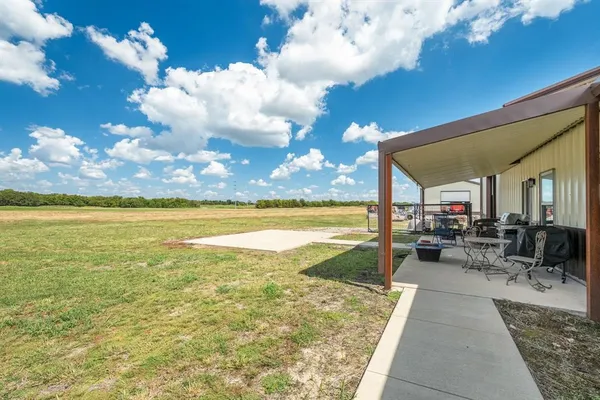 a view of swimming pool with outdoor seating