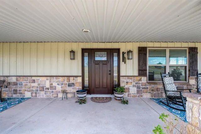 an outdoor space with patio furniture
