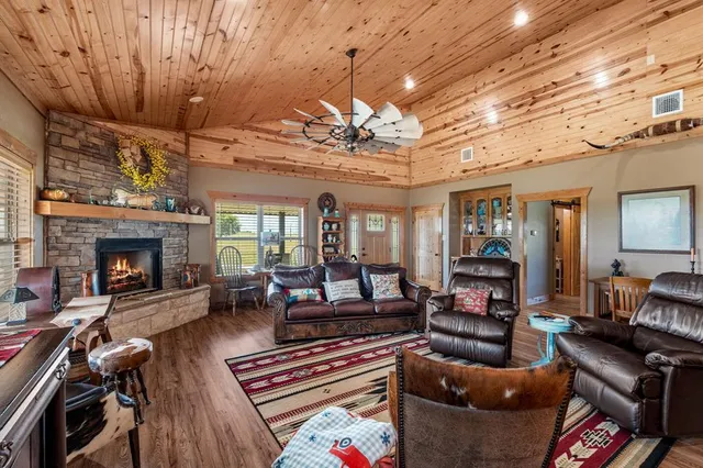 a living room with furniture and a fireplace