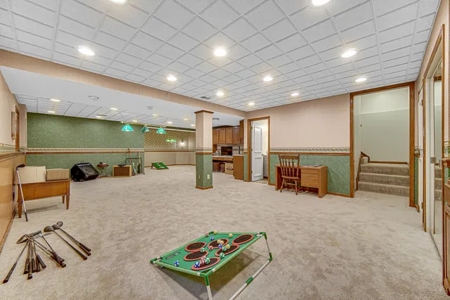 a kitchen with a table and chairs