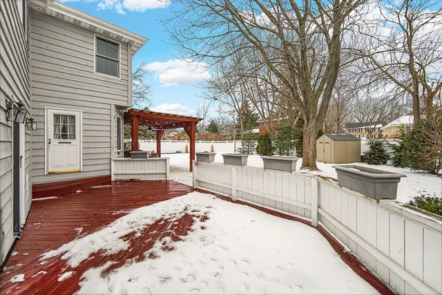 a view of a porch with furniture and next to a yard