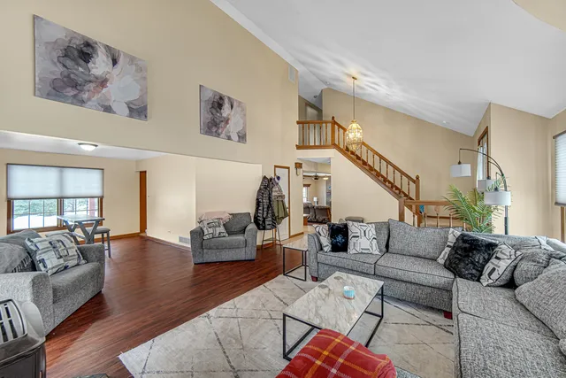 a living room with furniture or couch and a wooden floor