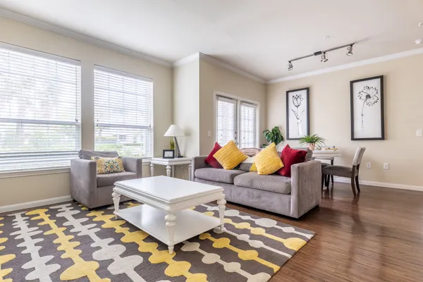 a living room with furniture and windows