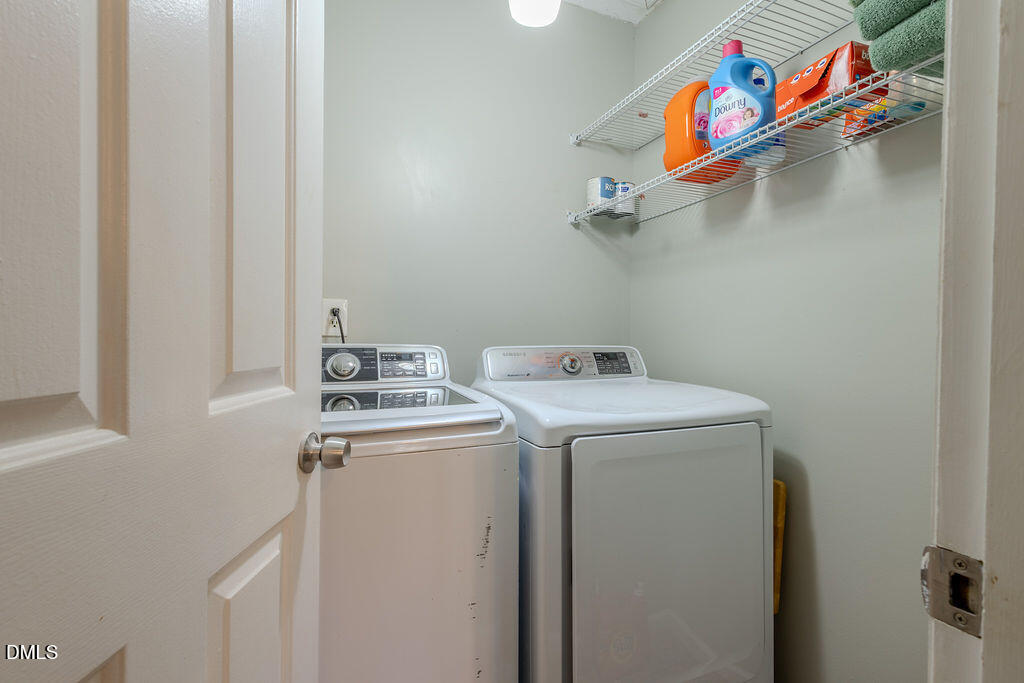 213 Bracken Court Raleigh, NC 27615 - Photo 11 of 20 a utility room with dryer and washer