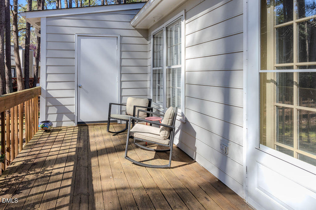 213 Bracken Court Raleigh, NC 27615 - Photo 12 of 20 a view of a balcony with chairs