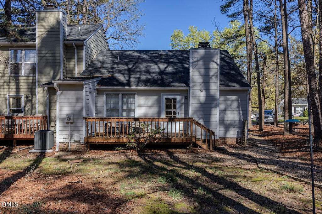213 Bracken Court Raleigh, NC 27615 - Photo 13 of 20 a front view of a house with large trees