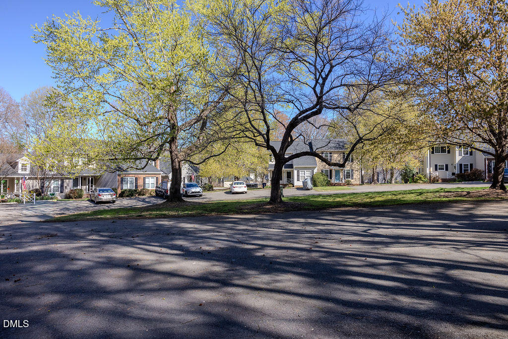 213 Bracken Court Raleigh, NC 27615 - Photo 14 of 20 a view of a yard with green space