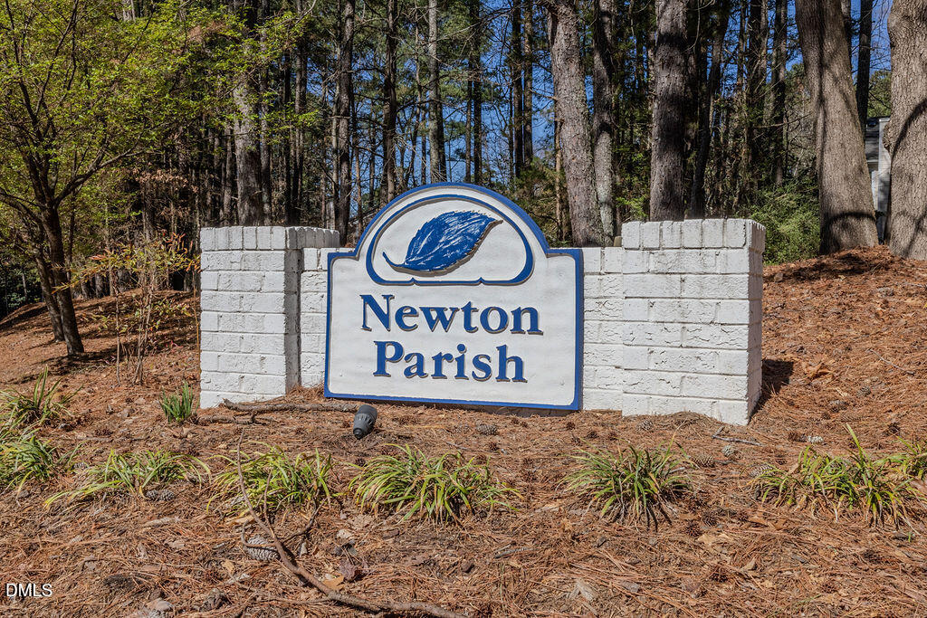 213 Bracken Court Raleigh, NC 27615 - Photo 15 of 20 a sign on the side of the road