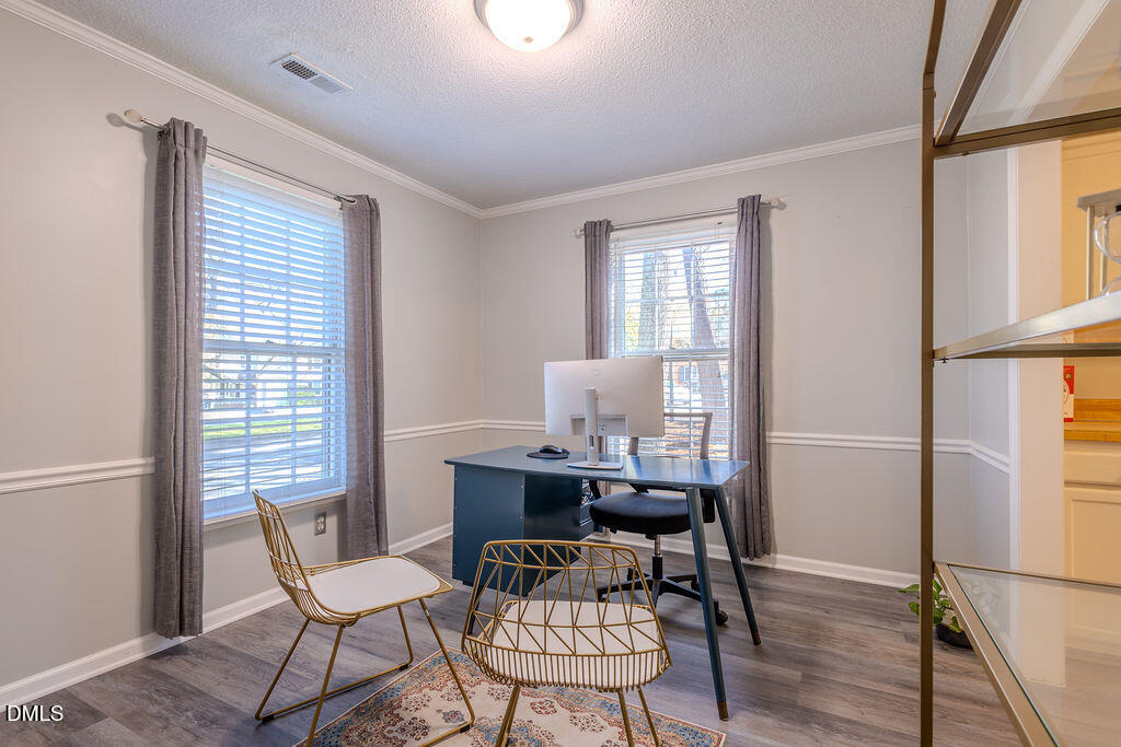 213 Bracken Court Raleigh, NC 27615 - Photo 3 of 20 a dining room with furniture and window