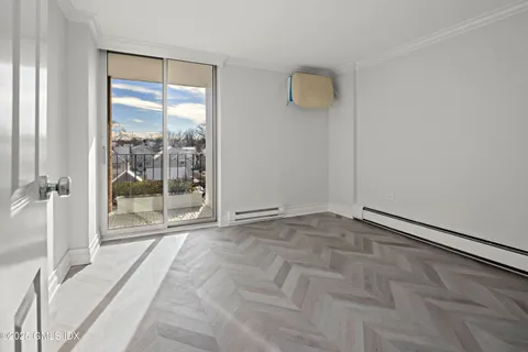 a room with a bed and a view of bathroom